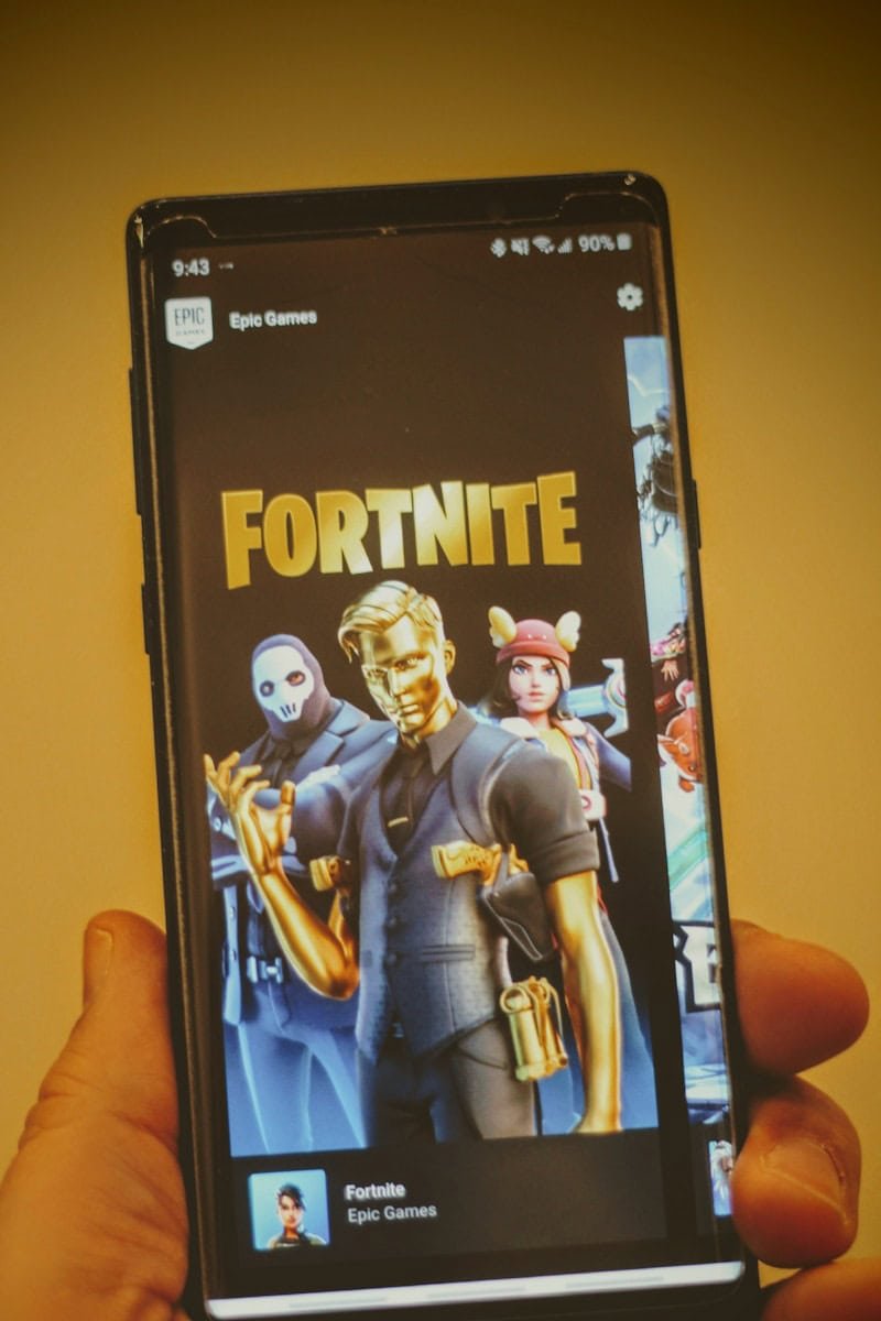 black samsung android smartphone displaying man in blue suit