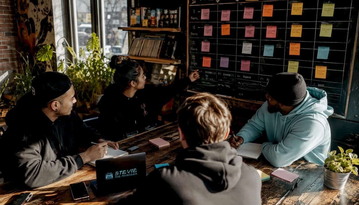 Hands writing mixtape promotion calendar