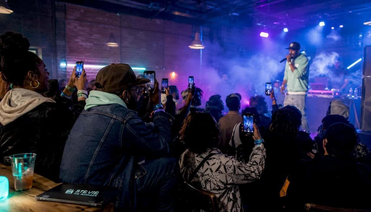 Audience recording hip-hop live show on smartphones